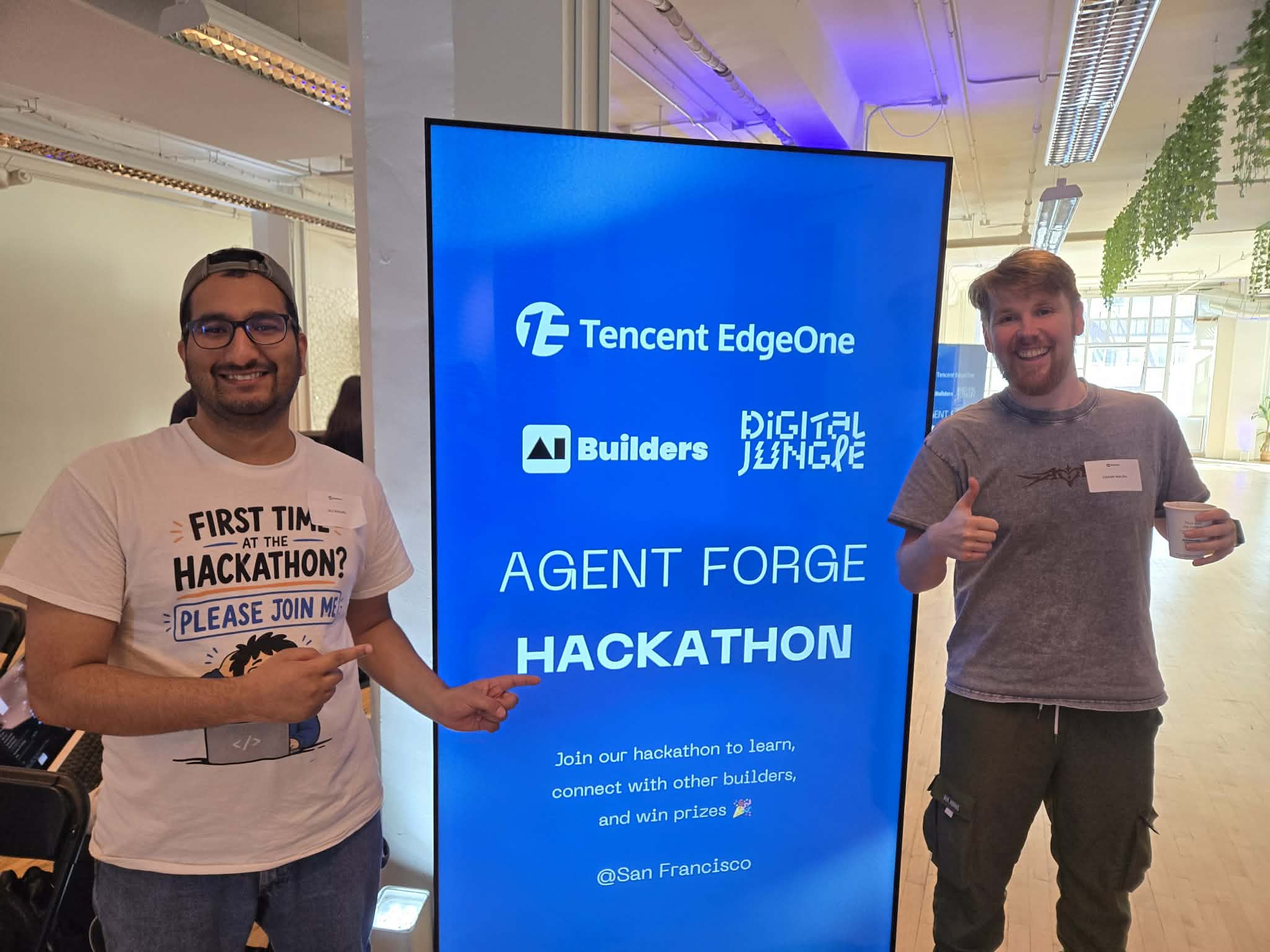 Ali and Frank in front of the Agent Forge Hackathon kickoff screen at Digital Jungle SF